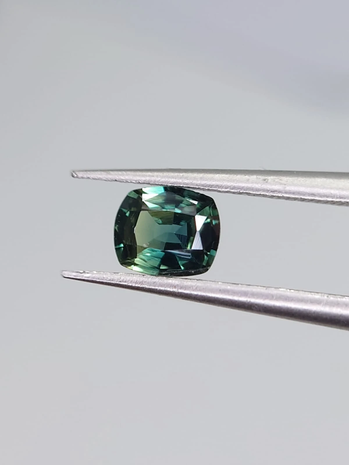 0.4ct Natural Bluish Green Sapphire from Nigeria — view 4